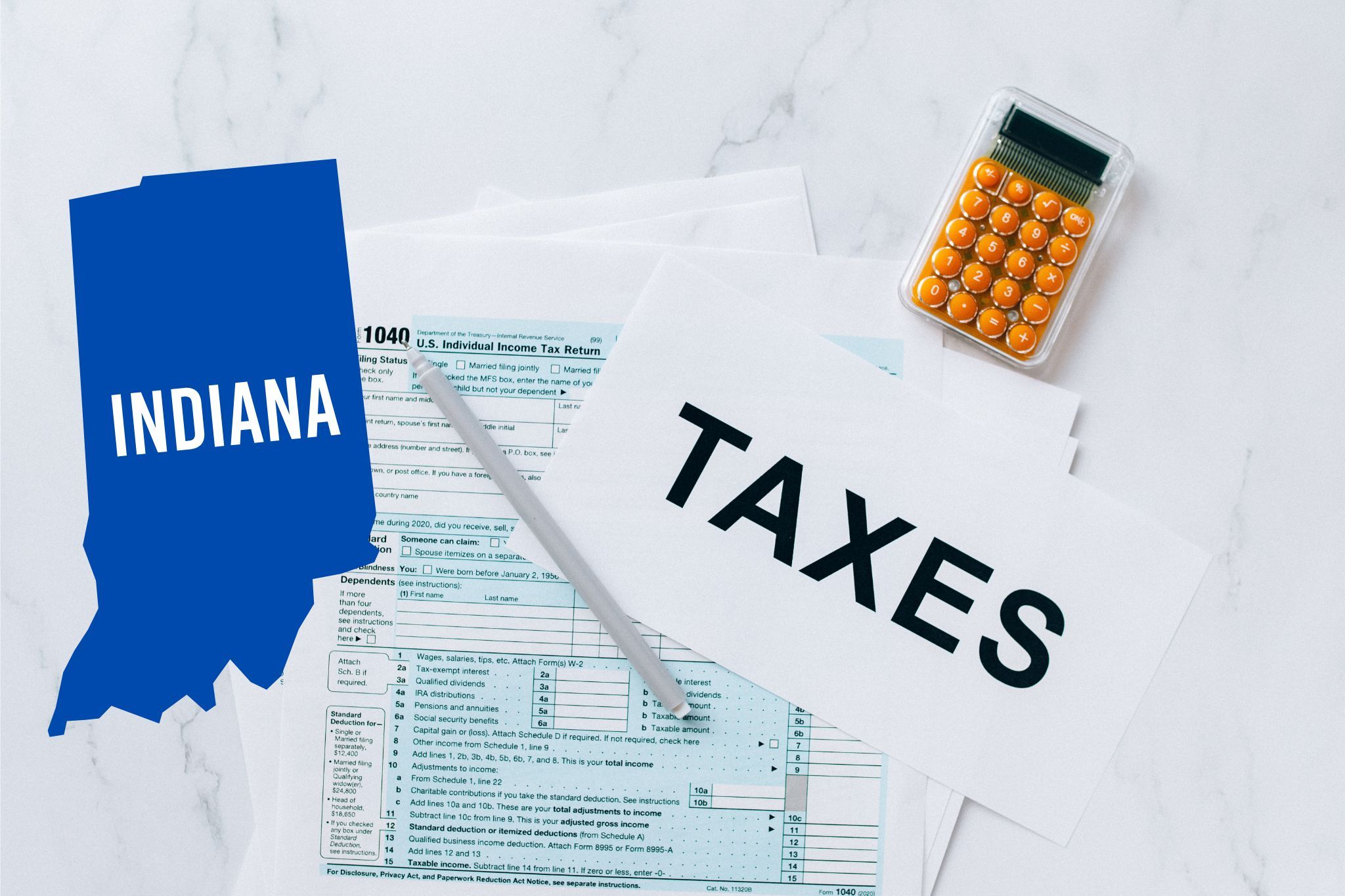 A capital gains calculator sits next to tax forms, a paper with the word 'TAXES', and an Indiana state logo on a white marble surface.