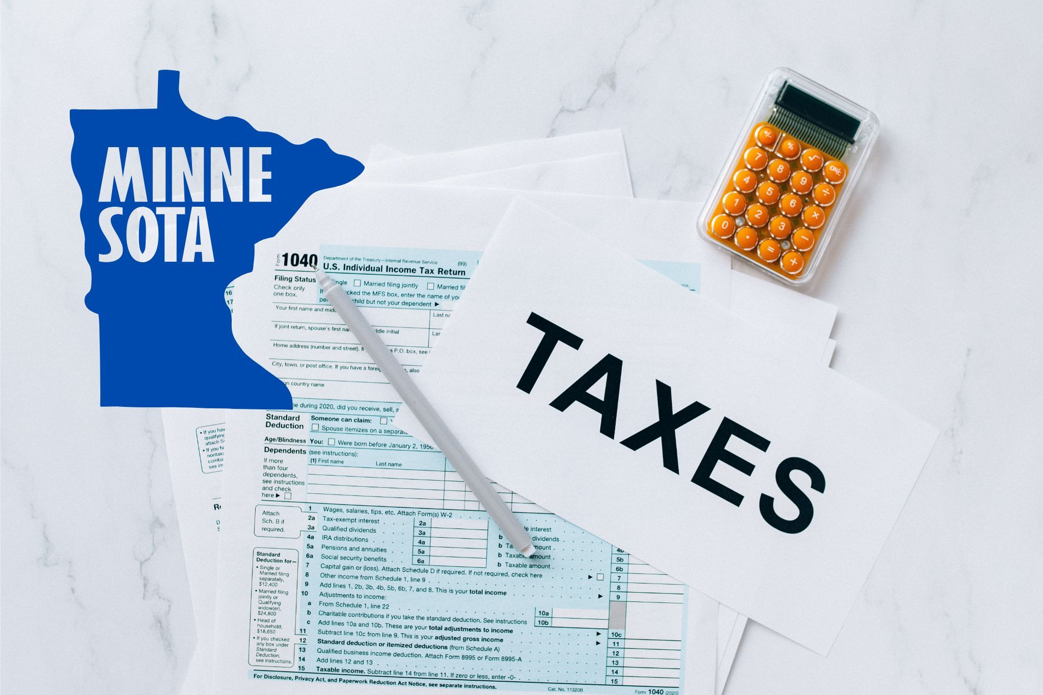 A capital gains calculator sits next to tax forms, a paper with the word 'TAXES', and an Minnesota state logo on a white marble surface.