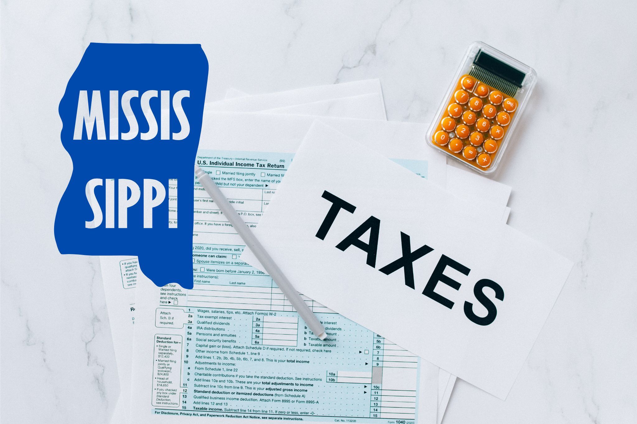A capital gains calculator sits next to tax forms, a paper with the word 'TAXES', and an Mississippi state logo on a white marble surface.