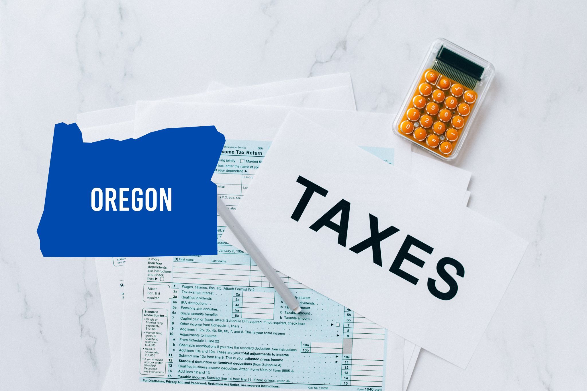 A capital gains calculator sits next to tax forms, a paper with the word 'TAXES', and an Oregon state logo on a white marble surface.