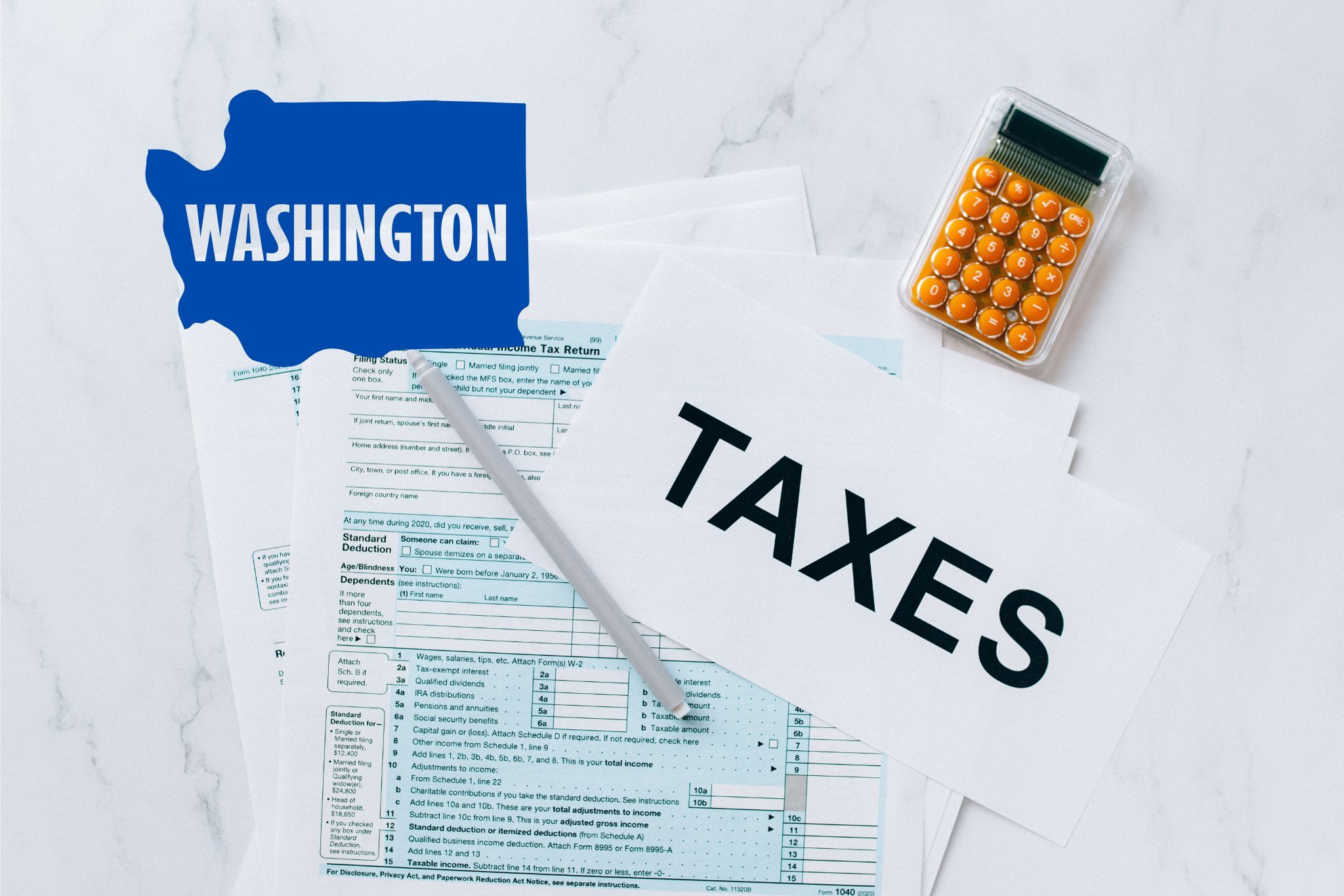 A capital gains calculator sits next to tax forms, a paper with the word 'TAXES', and an Washington state logo on a white marble surface.