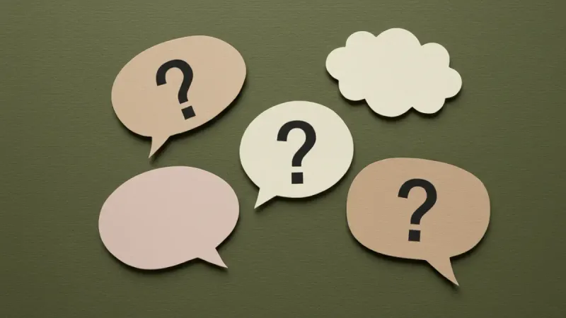 Question marks on a green background, invoking questions that arise when a company wants to buy your land