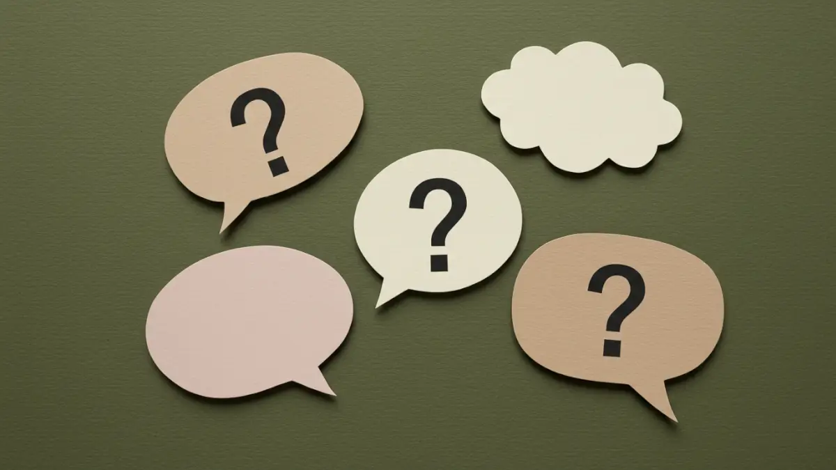 Question marks on a green background, invoking questions that arise when a company wants to buy your land