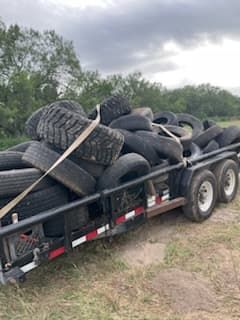 Dozens of tires piled up requiring proper disposal