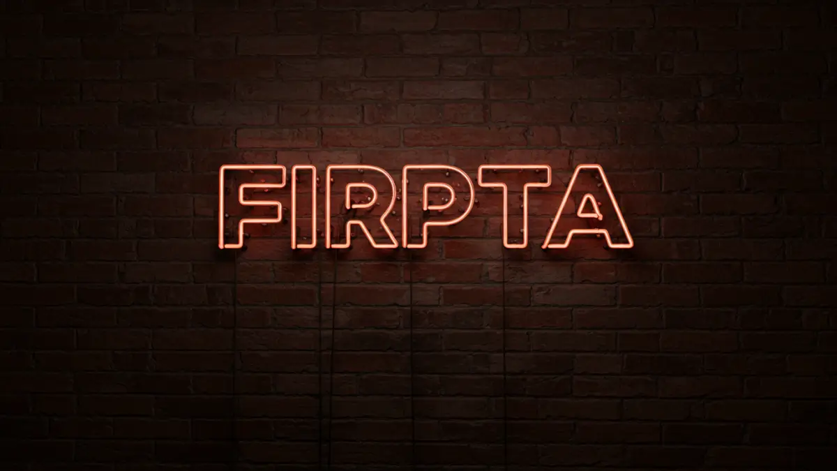 The word 'Tax' in neon letters on a dark background